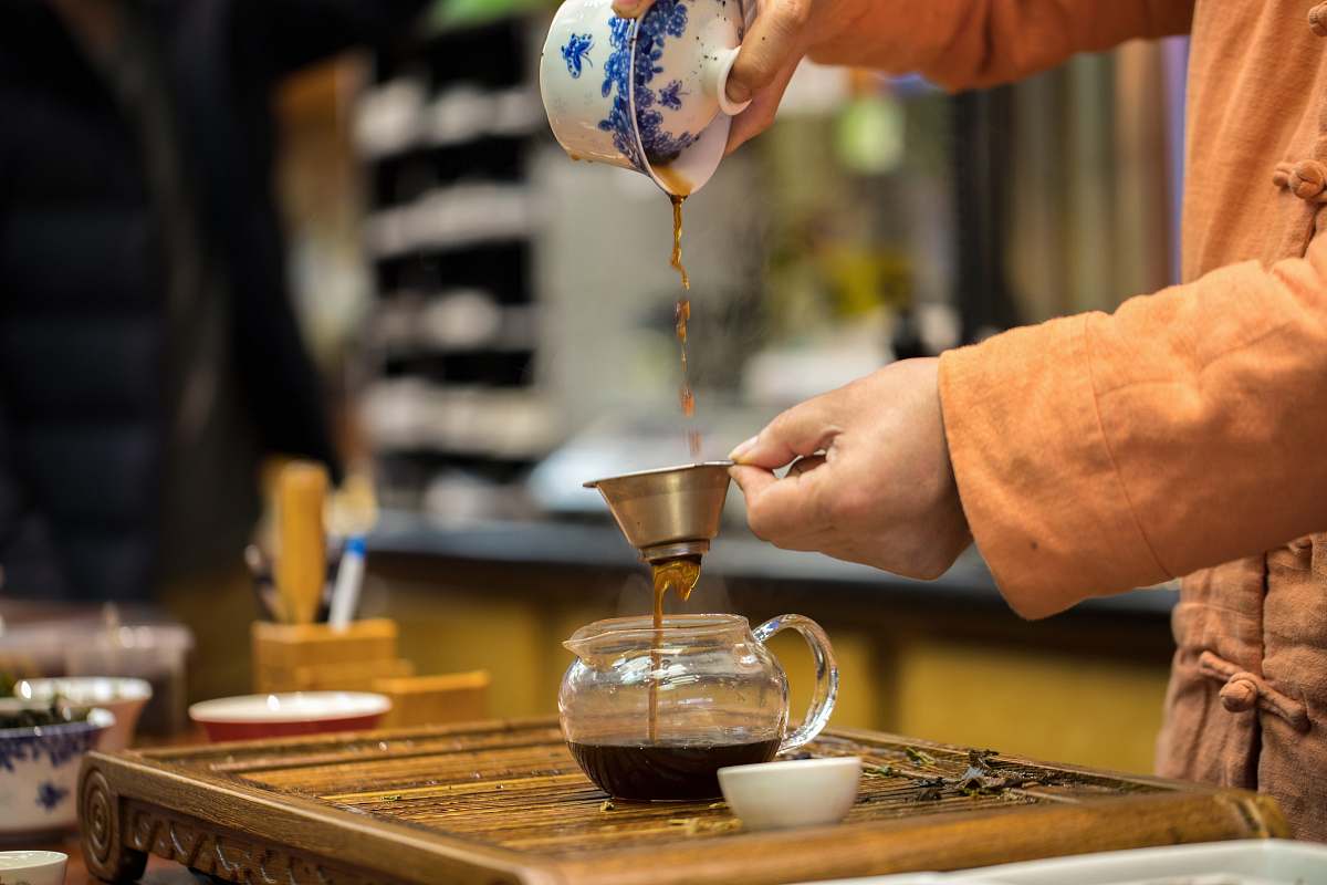 human person pouring tea person